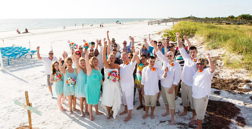 Wedding Group Photo on Honeymoon Island by Cara DeHart Lewis