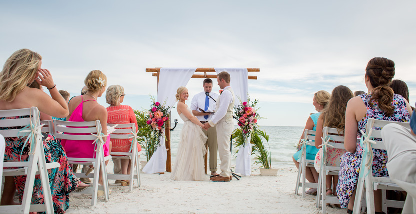 Couple smiling at Ceremony by Taken by Grace and Glory Photography