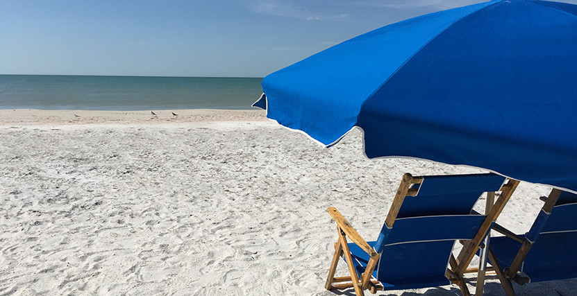 Umbrella and chair on beach