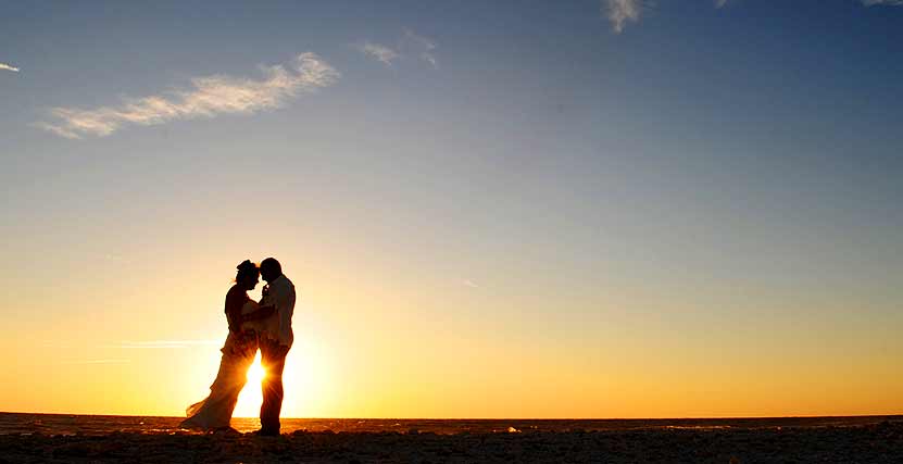 Honeymoon Island Bride and Groom on Beach at Sunset