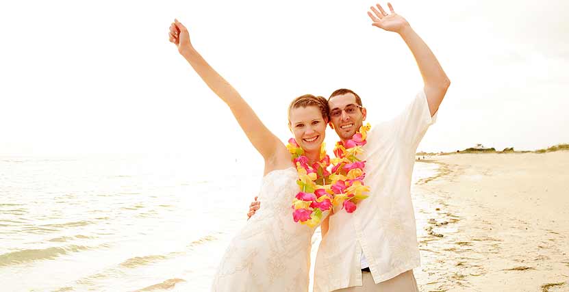 Honeymoon Island Bride and Groom Celebrating on Beach