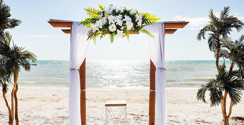 Silk White Flowers on Bamboo Arch on Honeymoon Island by Lime Light Photography